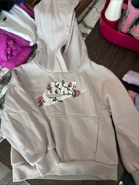 Nike Girls' Light Pink Hoodie with White Swoosh and Pink Floral Accents